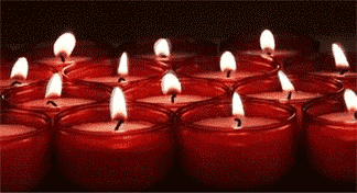 Animated GIF file of lit red glass votive candles.